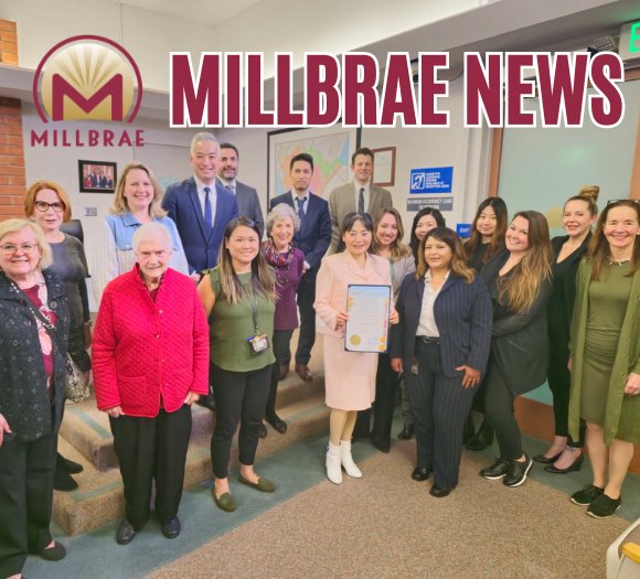 City Council poses with City Staff and Commission and Committee Members receiving the International Women's Day Proclamation
