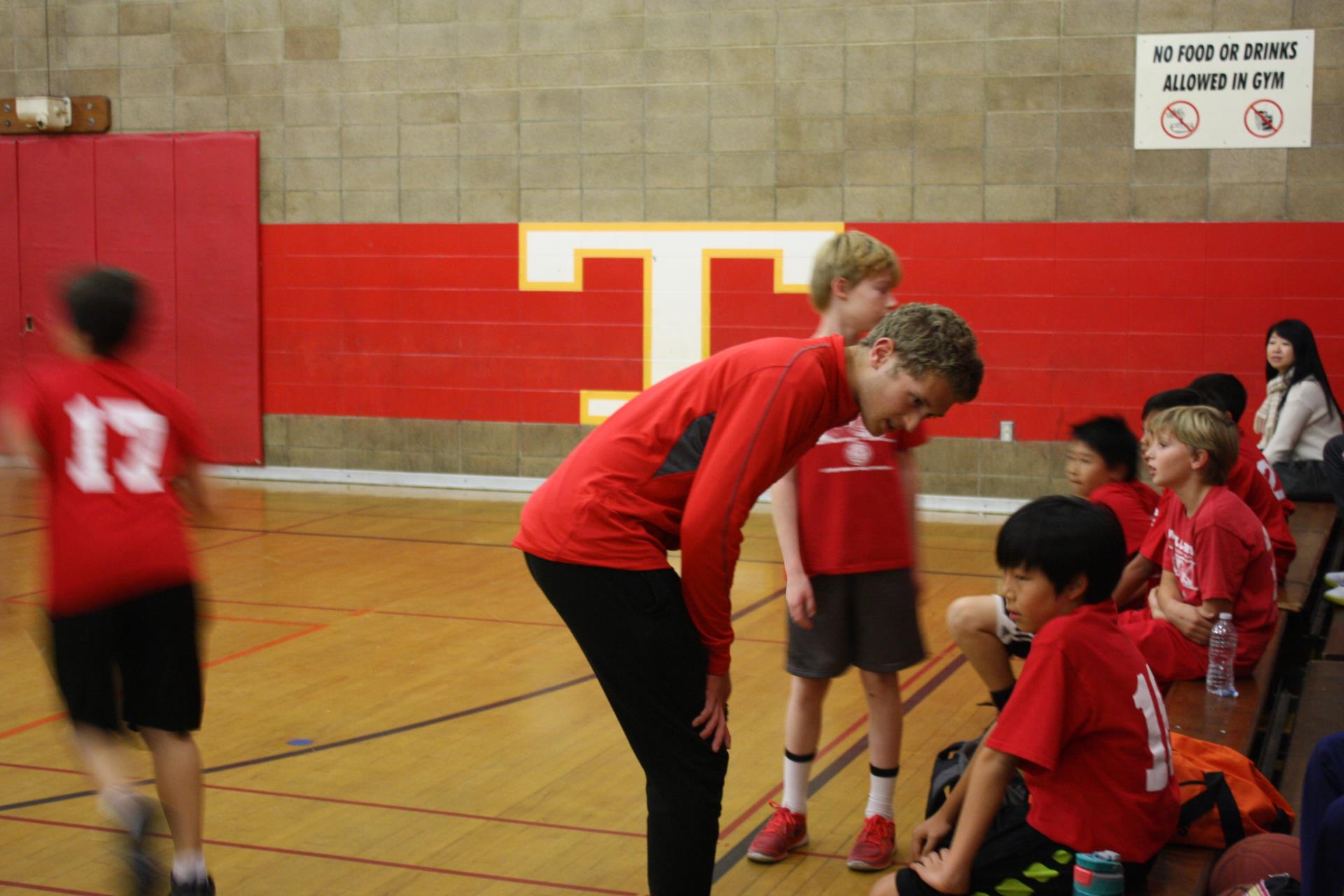 Staff Coaching Basketball Players